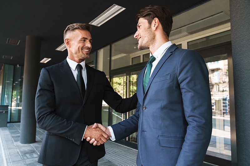 Two executives shaking hands