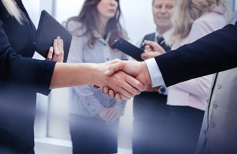 Two executives shaking hands